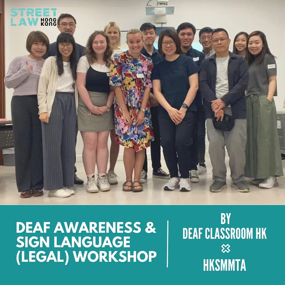 Group of diverse people posing for a photo at a "deaf awareness & sign language (legal education) workshop" hosted by deaf classroom hk and hksmmta.